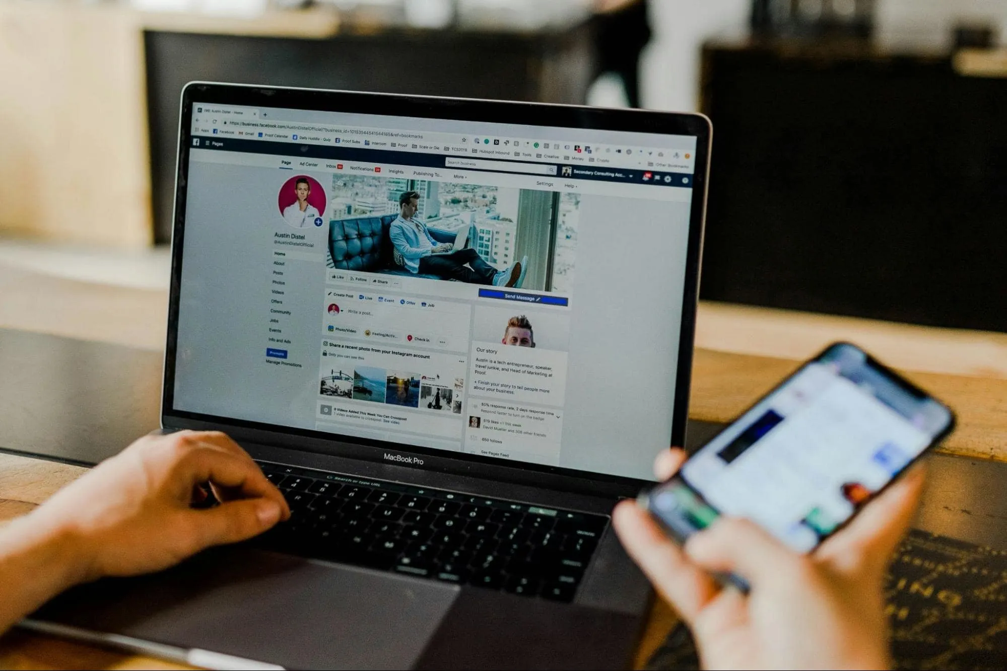 Hands using laptop and phone to manage a PR campaign on social media, focusing on how to track PR success through engagement and analytics